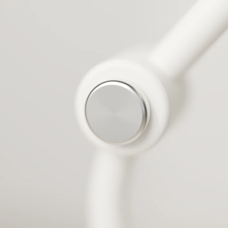 Close view of the brushed nickel dial at the elbow of Arc 01 in chalk.
